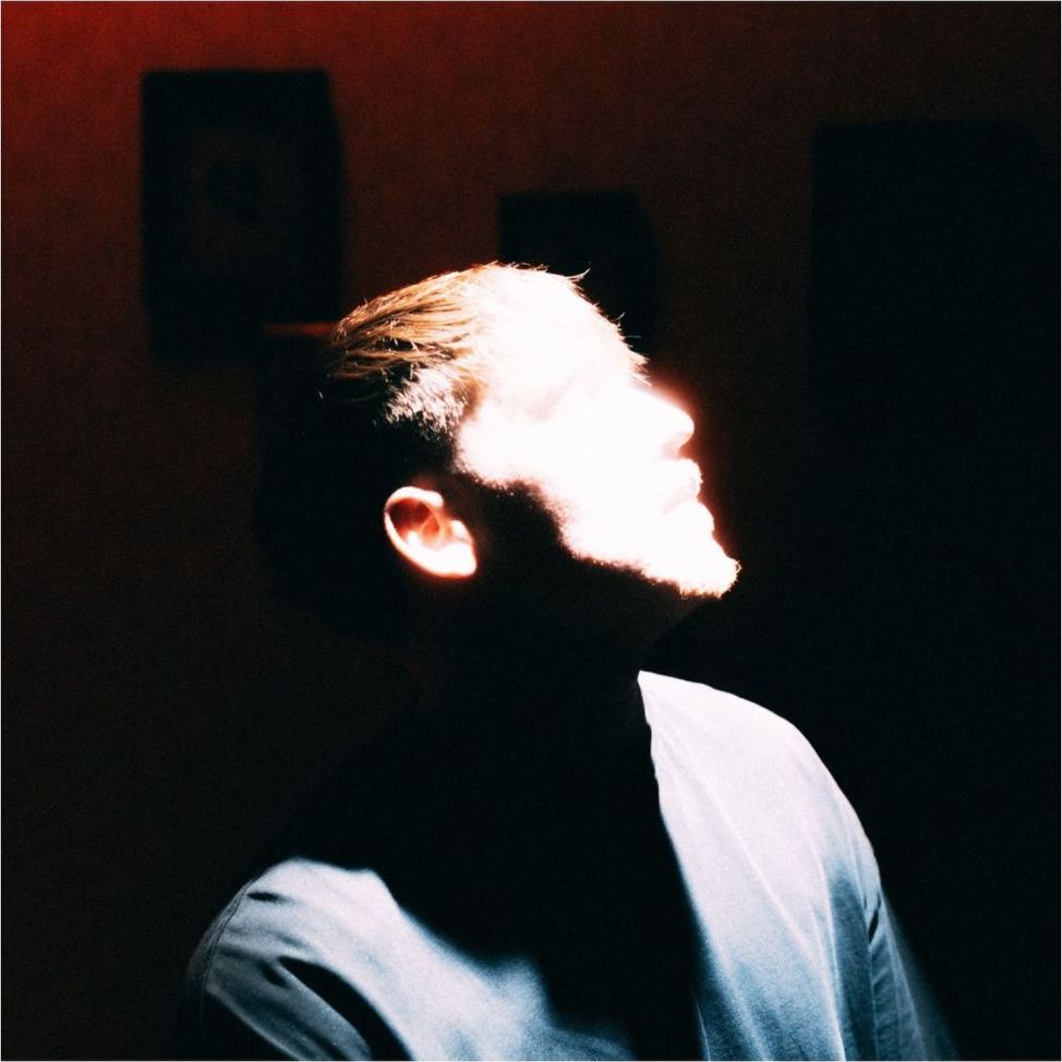 Cover art for Jude Barclay's song you're the reason: a profile lit in red